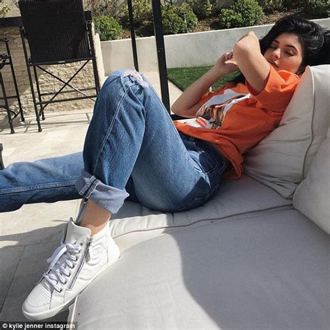 Kylie Jenner enjoys a sunbathing session at home in a 